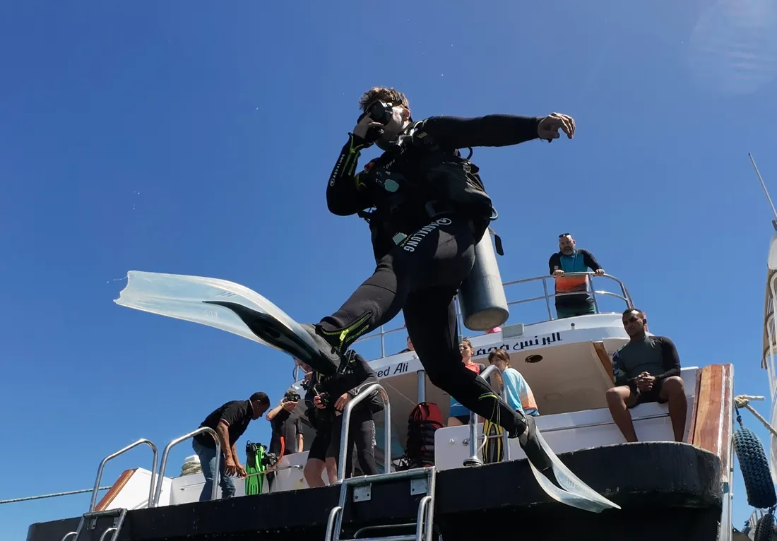 Diver leaping off the DiveRED boat into the Red Sea, Hurghada